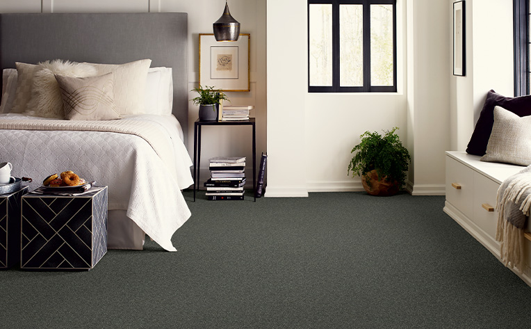 greenish-grey carpet in bedroom